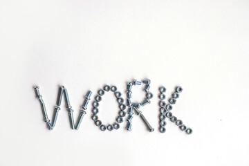 The inscription is the word work lined with bolts and nuts. Bolts and nuts on a white background.