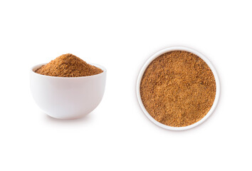 Heap of coconut sugar isolated on white. Heap of coconut sugar on white. Dark sugar isolated. Organic coconut unrefined sugar, isolated. Selective focus. Top view.sugar, isolated. Selective focus.