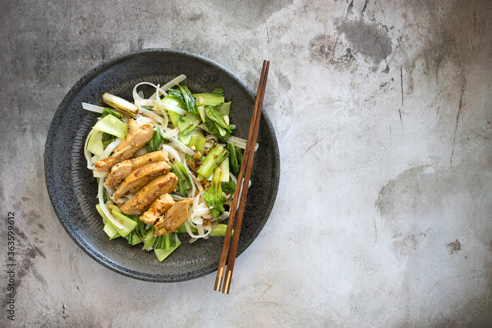 Wall mural Spicy Asian Chicken with Rice Noodles and Bok Choy