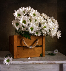 Still life with bouquets of blooming chrysanthemums. Interior. Vintage.