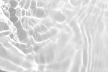 Closeup of desaturated transparent clear calm water surface texture with splashes and bubbles....