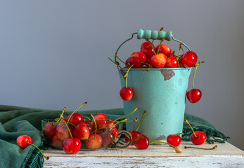 Fototapeta na wymiar Still life with ripe and tasty cherries in a bucket.