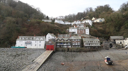 Village houses perched on the hillside above the fishing harbour at Clovelly, Devon, England.