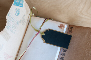 Part of a self-made paper notebook, with a black label to write on it about the covid-19 pandemic
