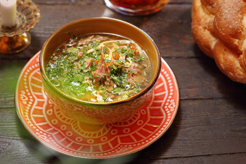 Chicken broth with noodles. Appetizing dish. Suggestion of serving a dish. Culinary photography.