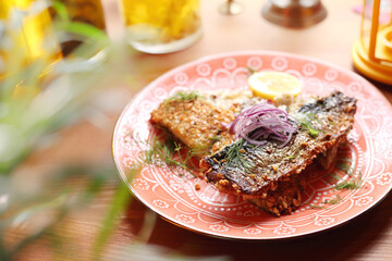 Fried fish fillet in almonds.
Appetizing dish. Suggestion of serving a dish. Culinary photography.