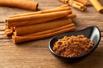 Close up cinnamon powder in a bowl background