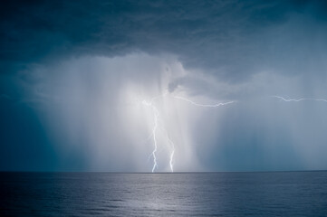 lightning over the sea in the night