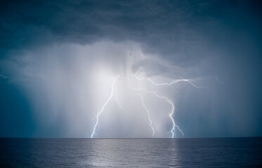 Naklejka na ściany i meble lightning over the sea in the night