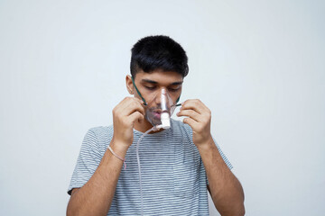 Young handsome asian teen boy wearing an oxygen mask, Stop Corona Virus and Stop pollution concept.