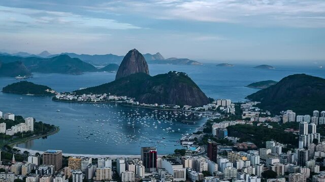 Rio de Janeiro, Brazil, sunset timelapse view of Rio cityscape including natural landmark Sugar Loaf Mountain and Guanabara Bay during summer. 