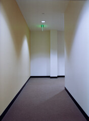Empty, windowless corridor in office building