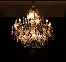 Crystal vintage chandelier in a dark room 
