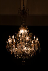 Crystal vintage chandelier in a dark room 