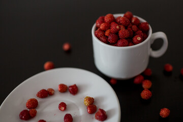 strawberry in a white Cup on a black background