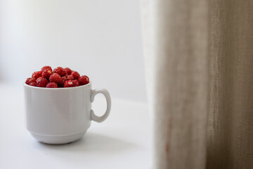 strawberry in a white Cup on a white background