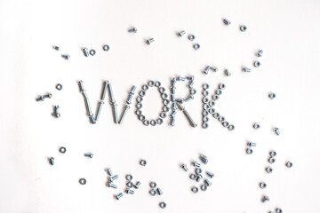 The inscription is the word work lined with bolts and nuts. Bolts and nuts on a white background.