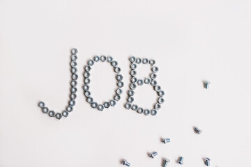 Text laid out of bolts and nuts on a white background.