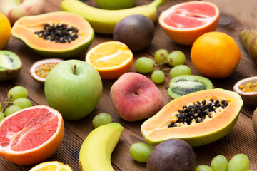 Summer fruit backround.Various fruits on wooden background. Summer concept. Flat lay, top view.