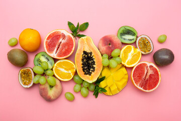 Summer fruits backround. Various fruits on pink background. Summer concept. Flat lay.