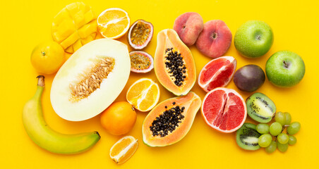 Summer abstract background with mix of various exotic fruits. Yellow fruit banner.