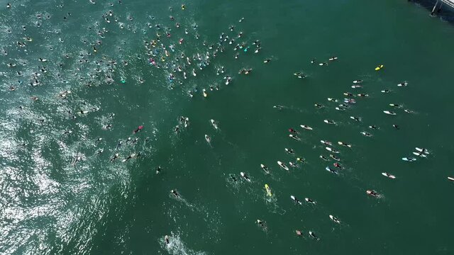 2020 - aerial over surfers in circle during BLM Black Lives Matter Paddle For Freedom gathering in California.