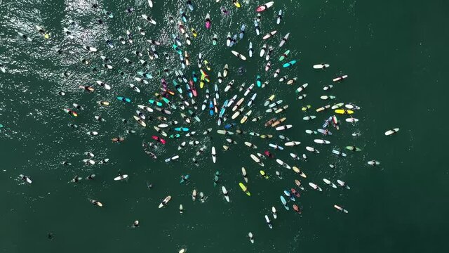 2020 - aerial over surfers in circle during BLM Black Lives Matter Paddle For Freedom gathering in California.