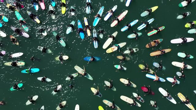 2020 - aerial over surfers in circle during BLM Black Lives Matter Paddle For Freedom gathering in California.