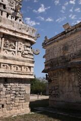 Ancient Mayan ruins the temple with three-dimensional masks of the Maya god of rain chac, at Chichen Itza, Mexico