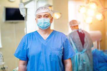 Horizontal photo of neurosurgeon on the robotic equipment background.