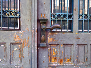 Old vintage door with grille and handle