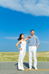 There are couples on the road.