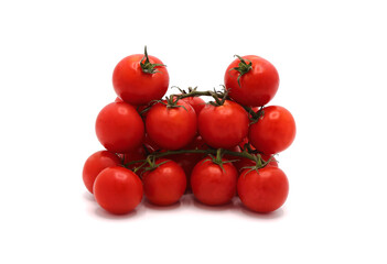Several red ripe tomatoes on a light background. Natural product. Natural color. Close-up.