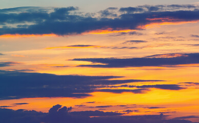 Beautiful sunset sky, clouds, orange haze. Natural background.
