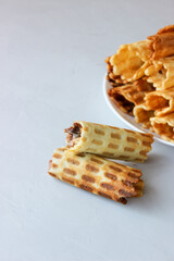 Waffle tubes stacked on a plate