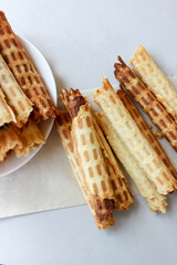Waffle tubes stacked on a plate