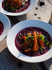 Beetroot soup recipe in bowl on table