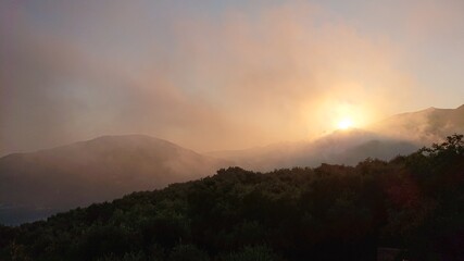 sunrise in the mountains with fog