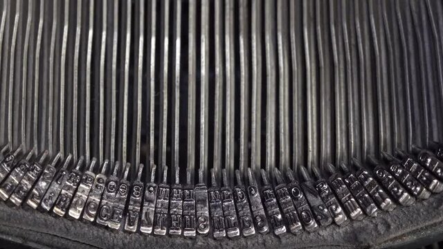 Close up view typebars of old antique typewriter. they works Typing.
