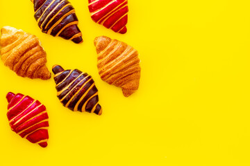 Croissants pattern - set of snacks on yellow background