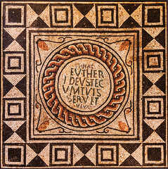 Fragment of an ancient floor mosaic. Colorful small tiles, ornament and regular forms. Roman, Italy
