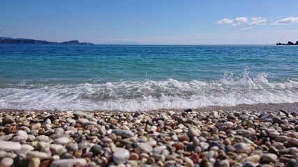 Fototapeta na wymiar beach and sea with small waves
