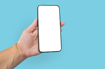 Modern smartphone with blank screen in female hand isolated on blue background mock up.
