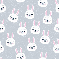 Seamless winter pattern with rabbit head face with closed eyes. Cute cartoon funny character on grey background.