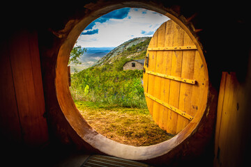 Round door overlooking the landscape.