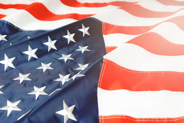 American flag waving in the wind, stars and stripes closeup