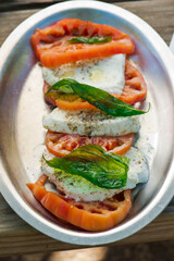 Salad. Classic American or French restaurant salad made w/ kale, Arugula, almonds, blueberries, walnuts, tomatoes, bacon, blue cheese, avocado, tossed w/ olive oil.