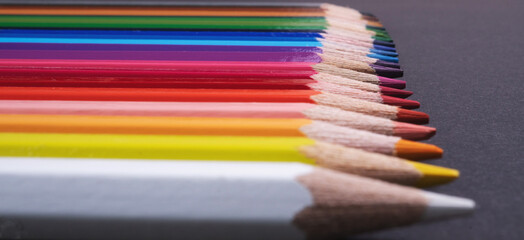 colorful pencils and Back to School Concept with Stationery and Blackboard