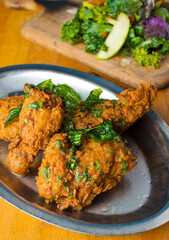 Fried Chicken. Free range chicken, soaked in buttermilk and dredged in flour deep fried in a cast iron skillet. Classic American Southern cuisine favorite.
