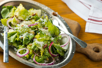 Salad. Classic American or French restaurant salad made w/ kale, Arugula, almonds, blueberries, walnuts, tomatoes, bacon, blue cheese, avocado, tossed w/ olive oil.